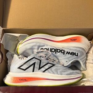 New Balance White Running Shoes with Neon Yellow and Orange Accents
